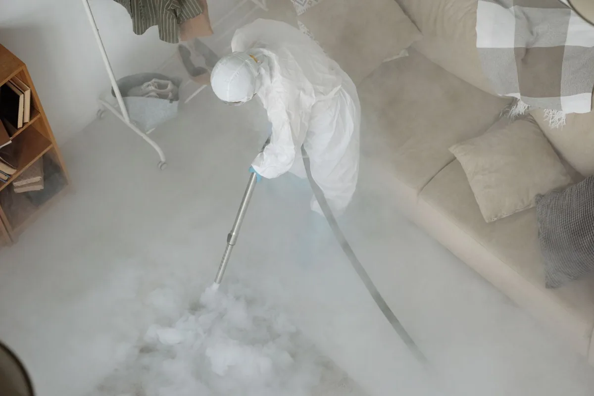 Biohazard cleanup technician in protective equipment, Ballville, OH